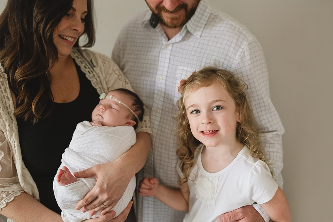 family photo focused on the little girls at newborn session in memphis, tn