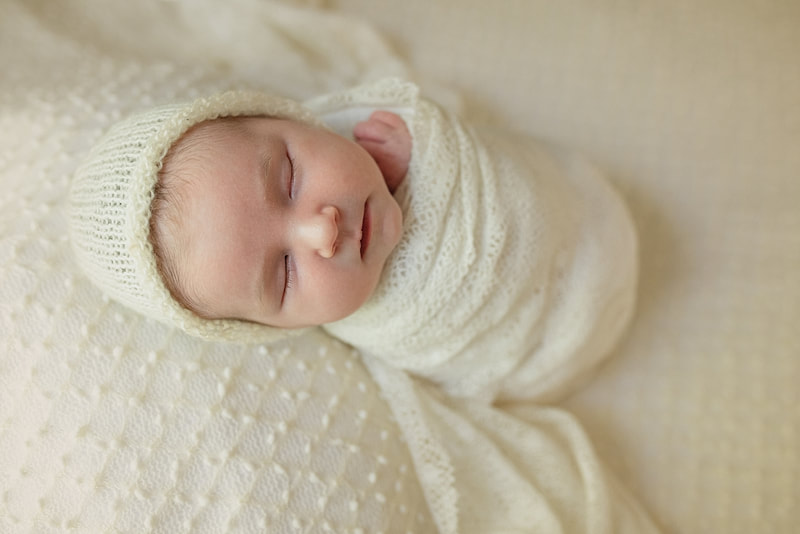 Baby girl swaddled in lace during newborn photos with Sarah Morris Photography in Memphis, TN