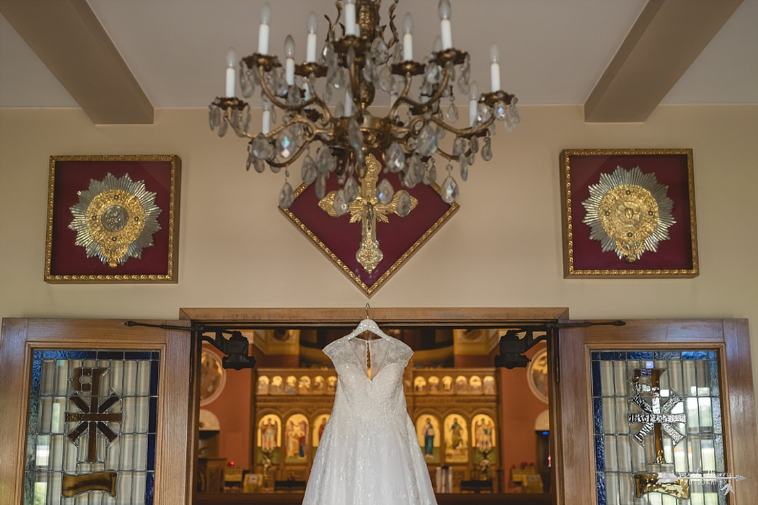 Wedding dress hanging on the doorway at Annunciation Greek Orthodox Church in Memphis, TN