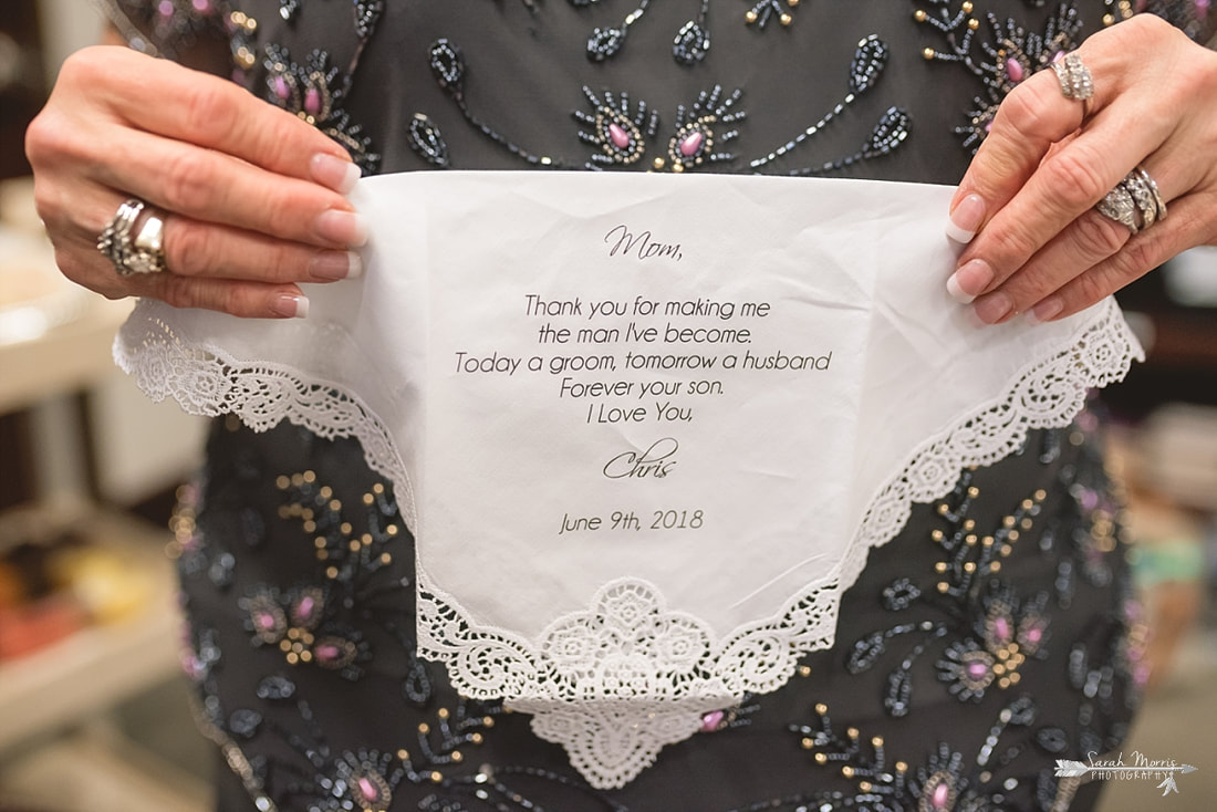 Mother of the Groom holding a personalized hankerchief at Annunciation Greek Orthodox Church in Memphis, TN