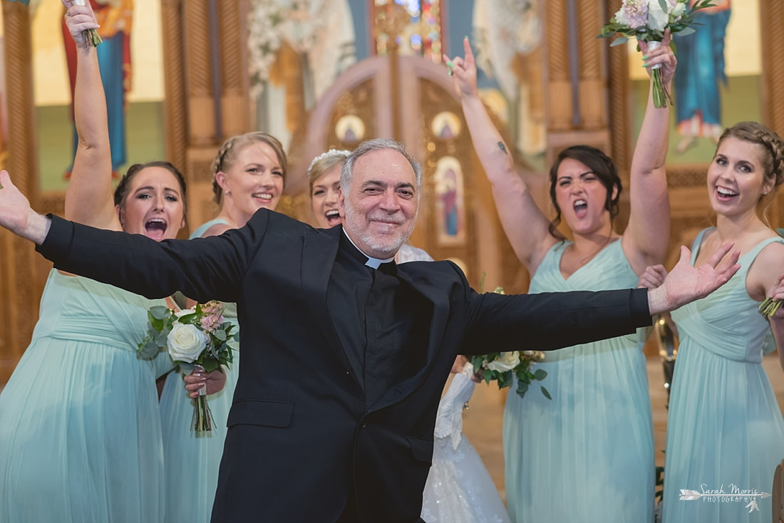 Father photobombing the Bridal Party at Annunciation Greek Orthodox Church in Memphis, TN