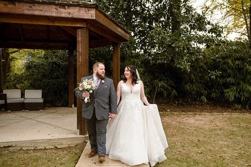 Bride and groom walking hand in hand at Avon Acres during wedding photos with Sarah Morris Photography