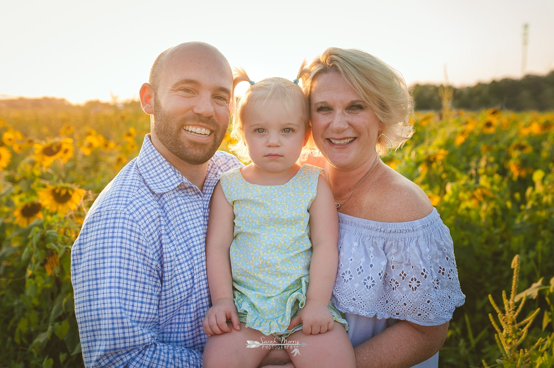 family photos in sunflower field at the agricenter, memphis, tn