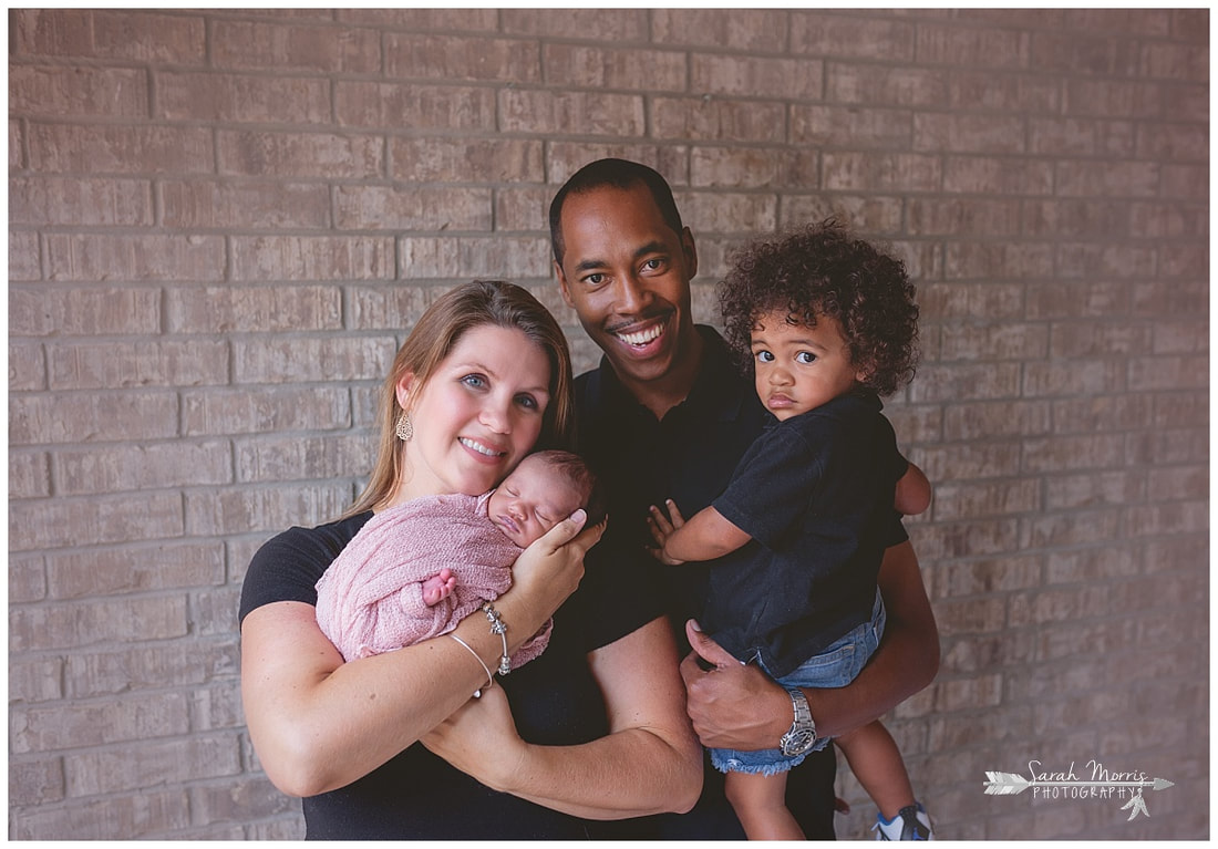 newborn photos of baby girl with mother and father and toddler sibling