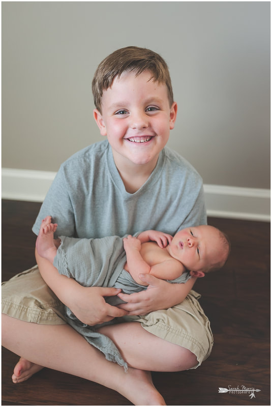 Newborn photos with older siblings