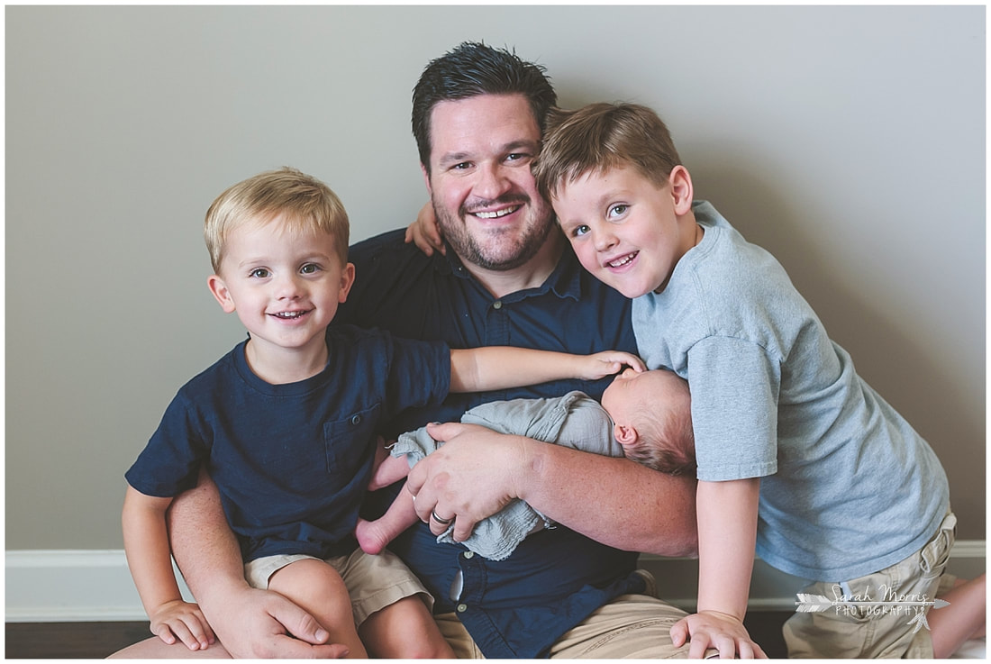 Newborn photos with dad and older siblings