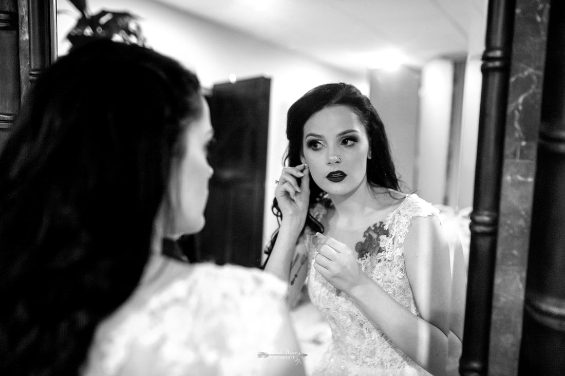 bride putting her earrings in at Overton Chapel, Memphis Wedding Photographer