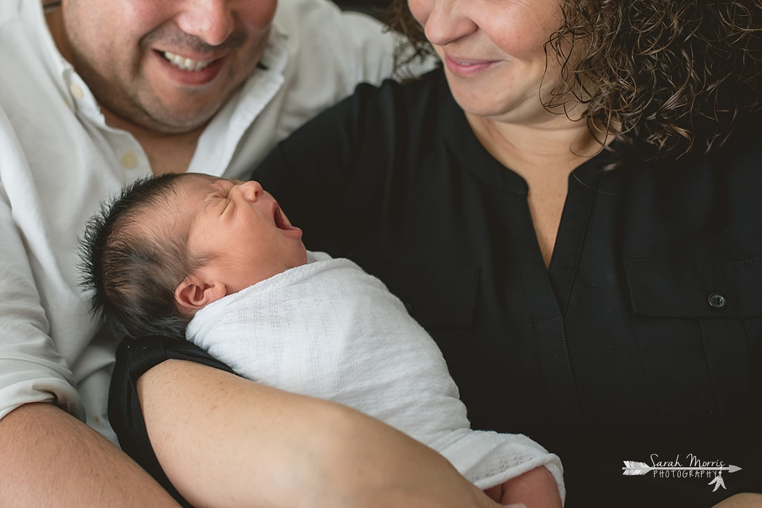 close up of newborn yawn during lifestyle portion of her newborn session