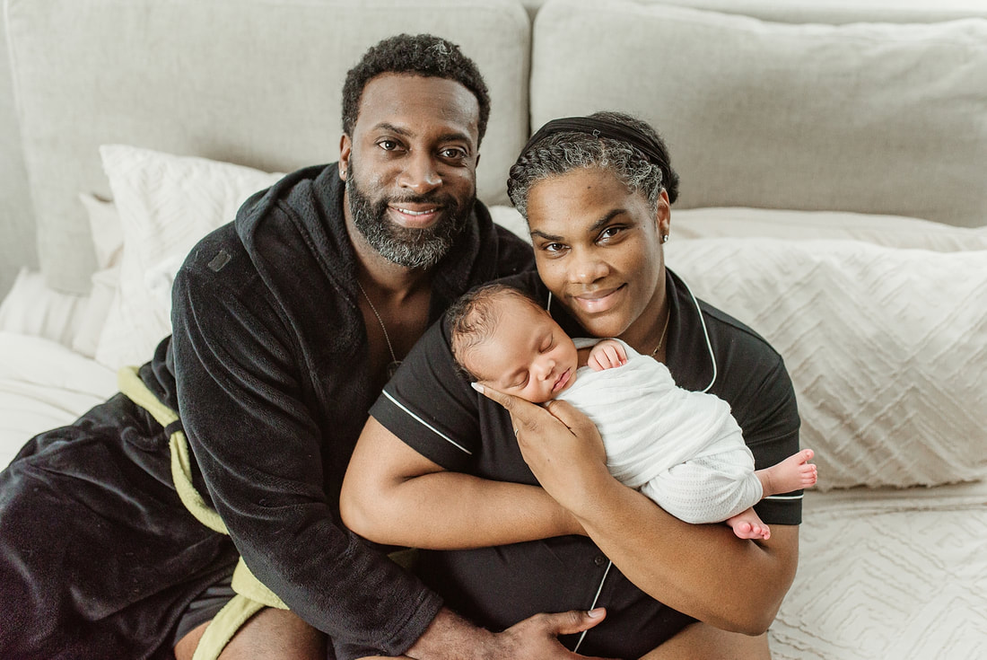 portrait of new parents with newborn baby in Memphis, TN