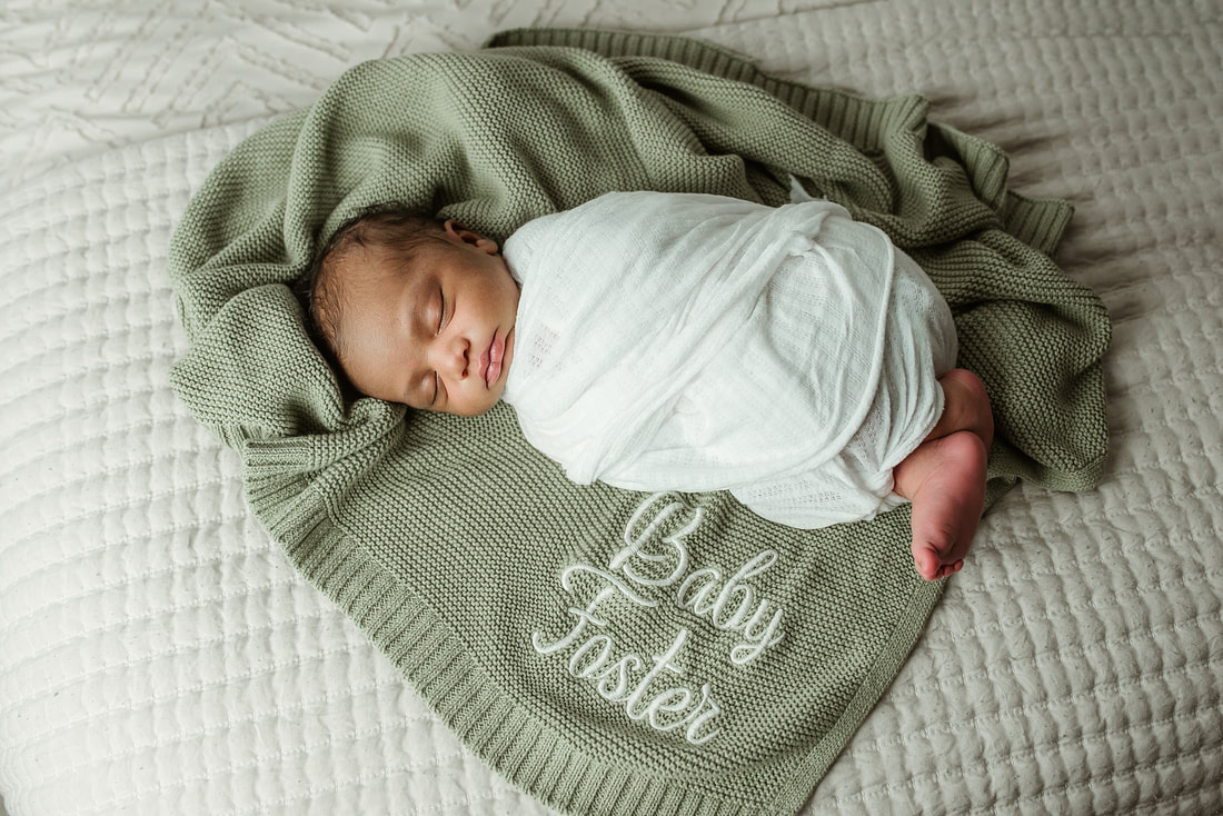 portrait of new parents with newborn baby in Memphis, TN