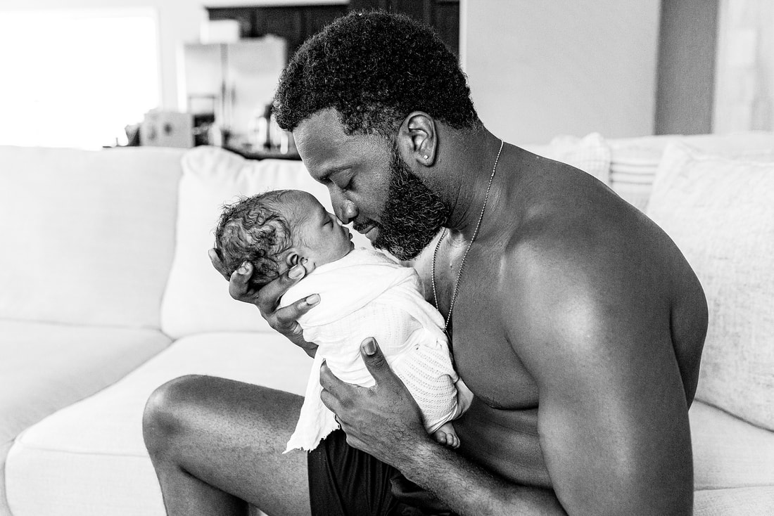 portrait of new parents with newborn baby in Memphis, TN