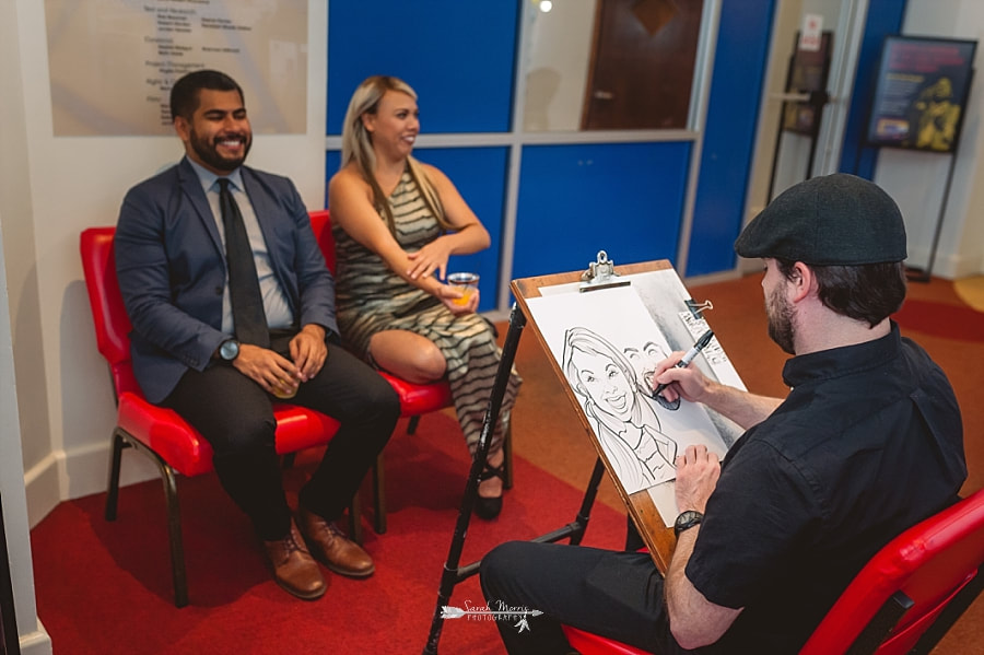 Caricaturist, Drawn by Matt, drawing caricatures of wedding guests at the Stax Museum