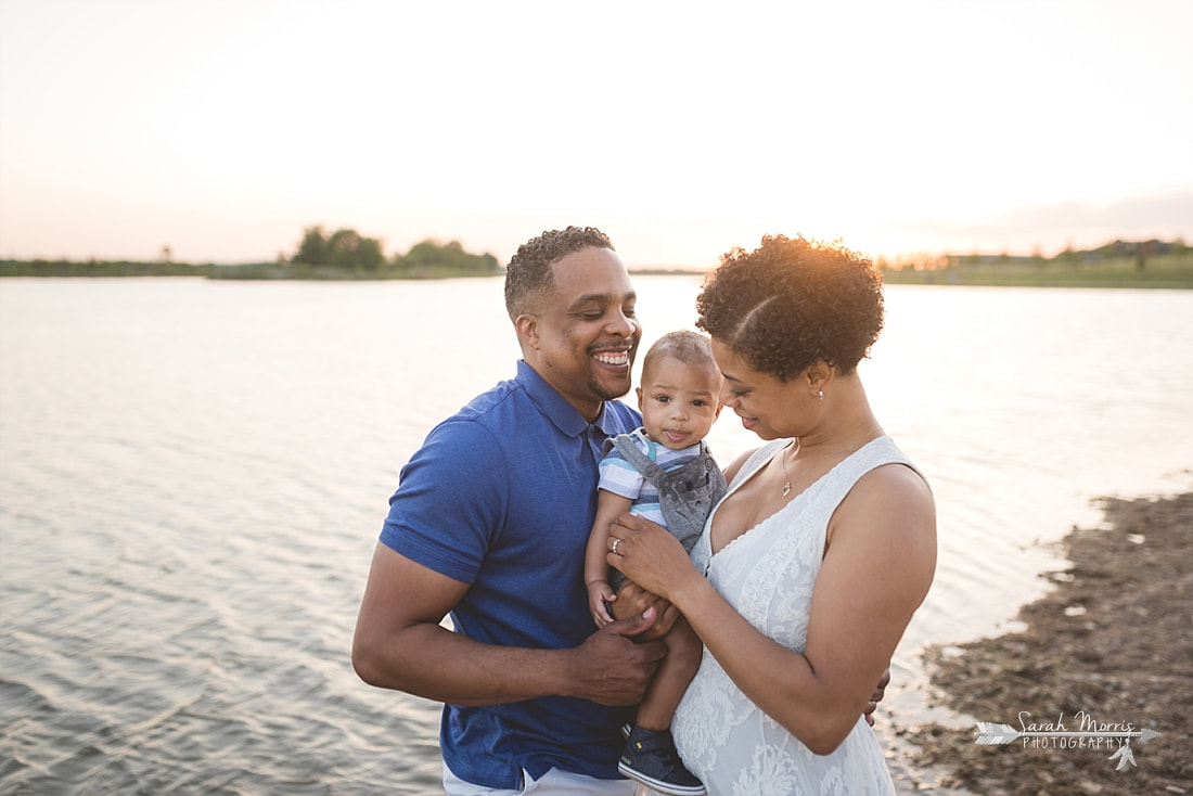 Family pictures on the bank of Patriot Lake at sunset at Shelby Farms Park