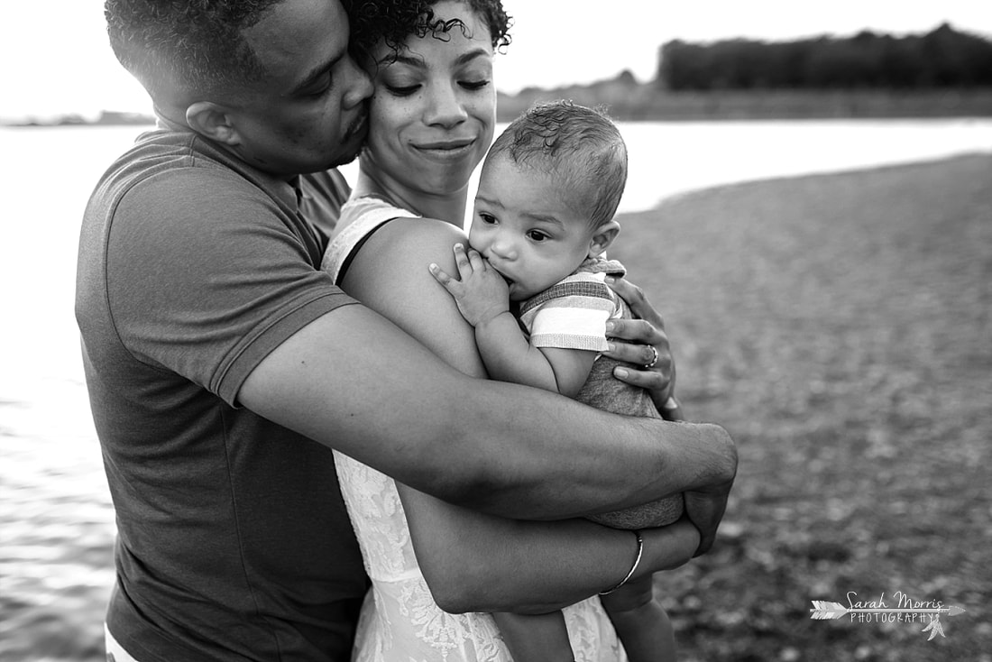 Family pictures on the bank of Patriot Lake at sunset at Shelby Farms Park