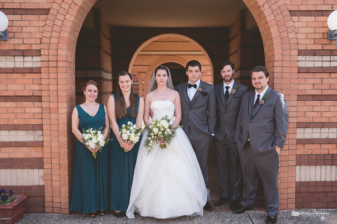 wedding party in the courtyard at St. Francis of Assisi Catholic Church