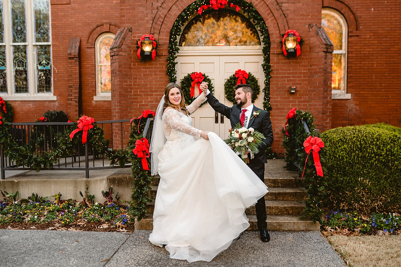 Bride and Groom dancing in the Collierville Town Square during wedding photos with Sarah Morris Photography