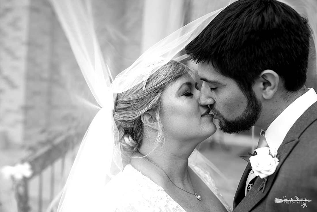 Bride and Groom under wedding veil at Annunciation Greek Orthodox Church in Memphis, TN